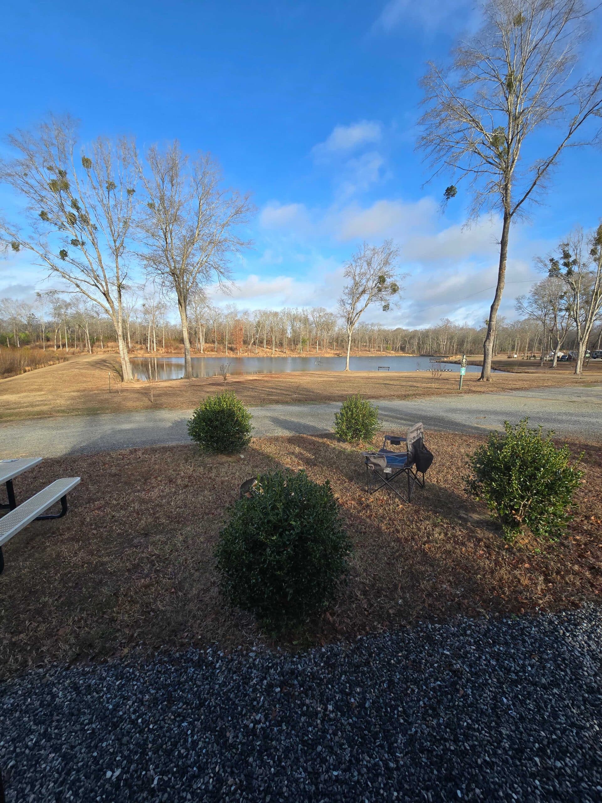 Pond-view site photograph from 4 County RV Park & Campground's booking listing