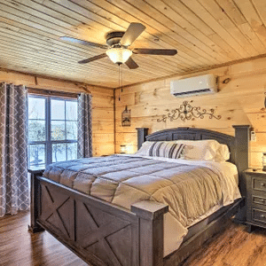 Main-level bedroom in the three-bedroom Cabins to Castles lakefront cabin