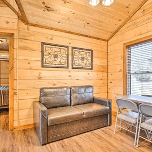 Main-level living room in the three-bedroom Cabins to Castles lakefront cabin