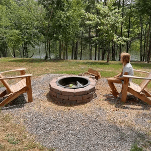Fire pit and picnic area at the three-bedroom Cabins to Castles lakefront cabin