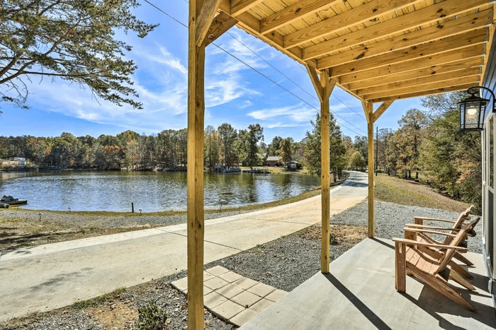 Covered deck overlooking the lake at the three-bedroom Cabins to Castles cabin