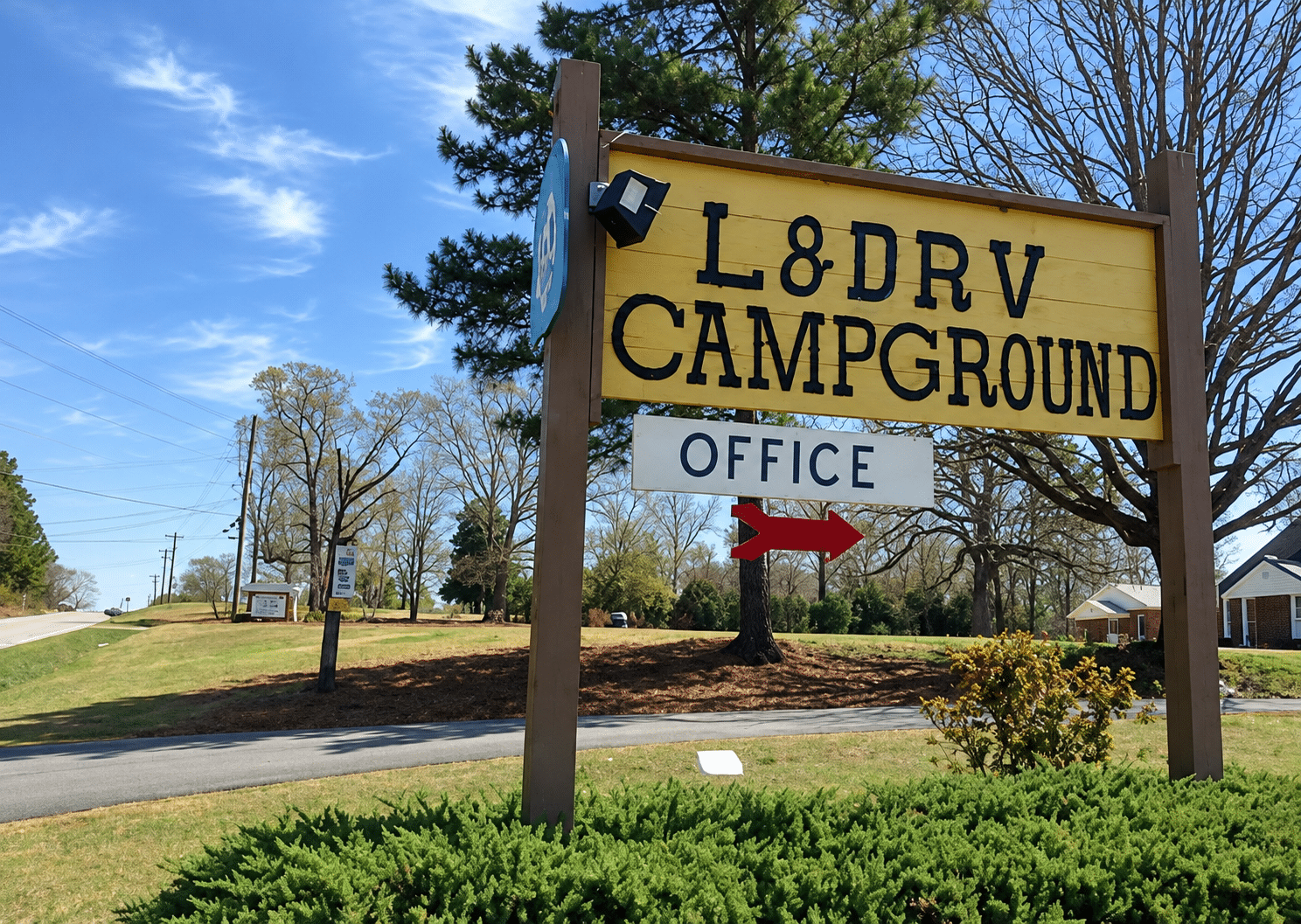RV camping area beside trees at L&D RV Park