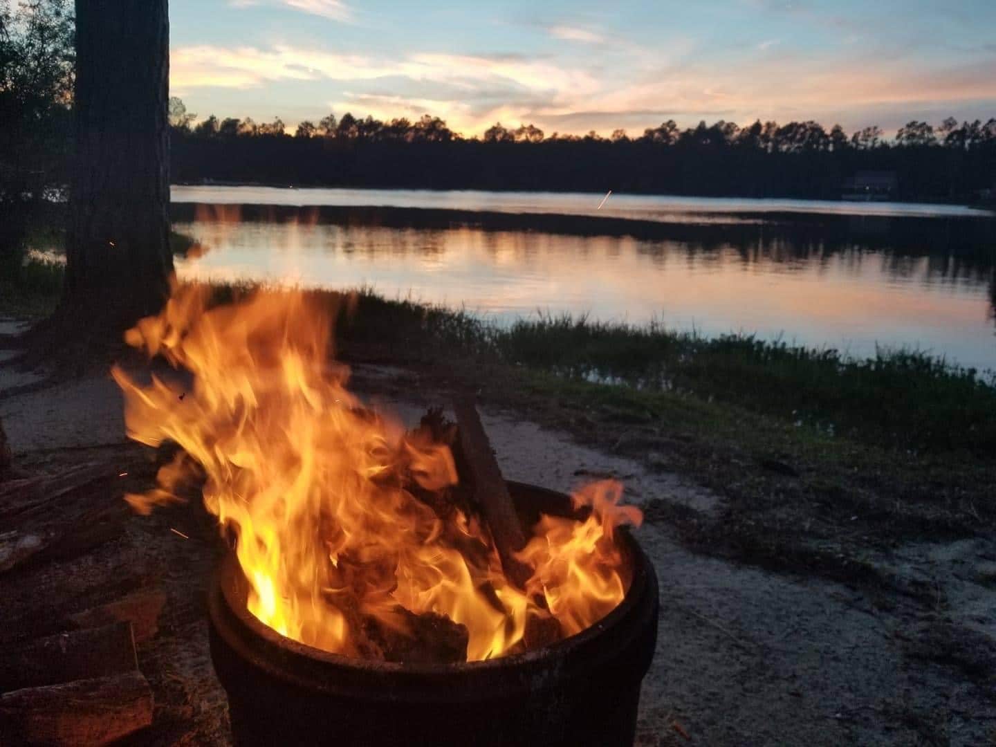 Campfire beside the lake at Lake Harmony RV Park