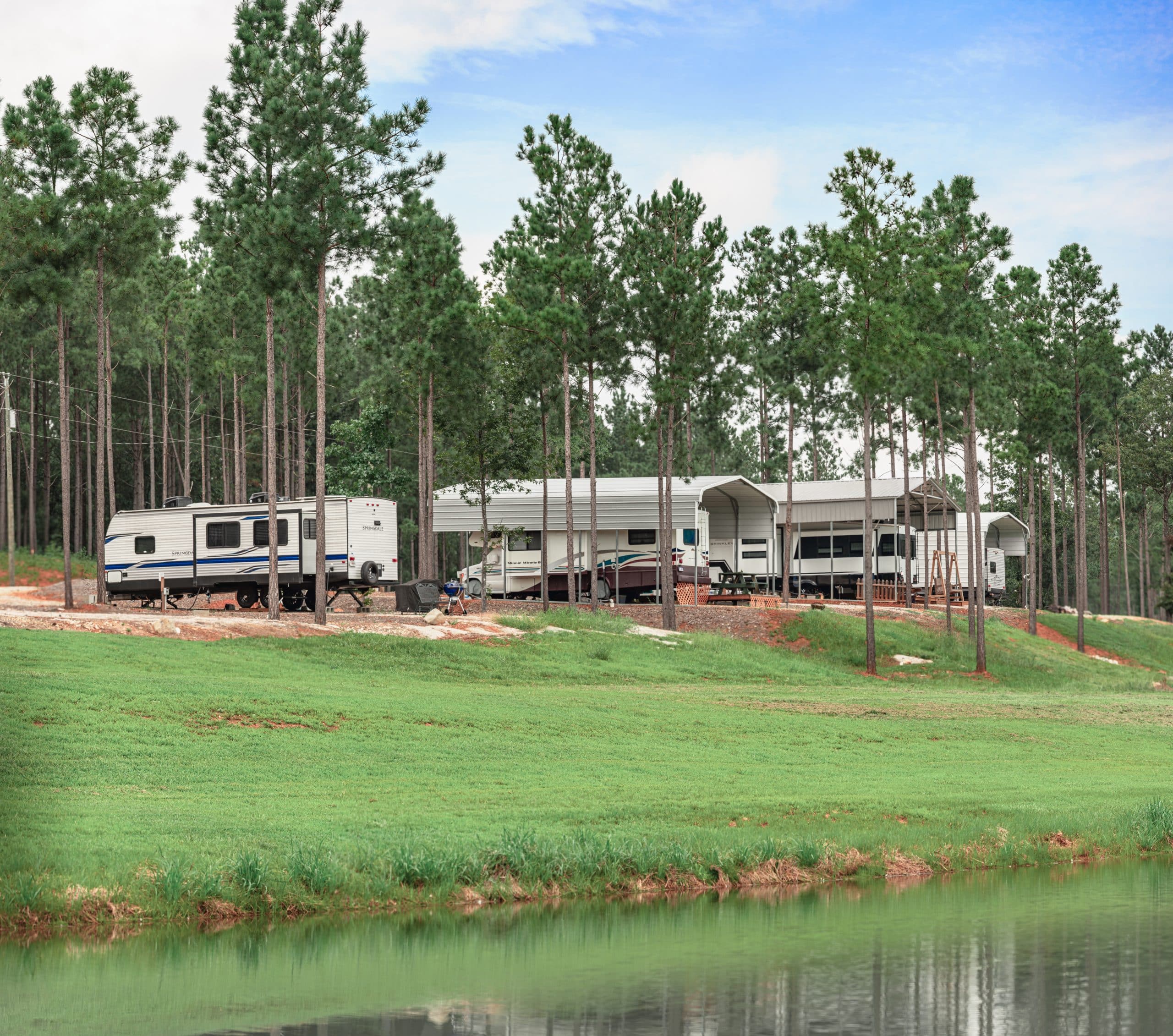 Long-term RV sites overlooking a pond at Little River RV Park at Durhamtown
