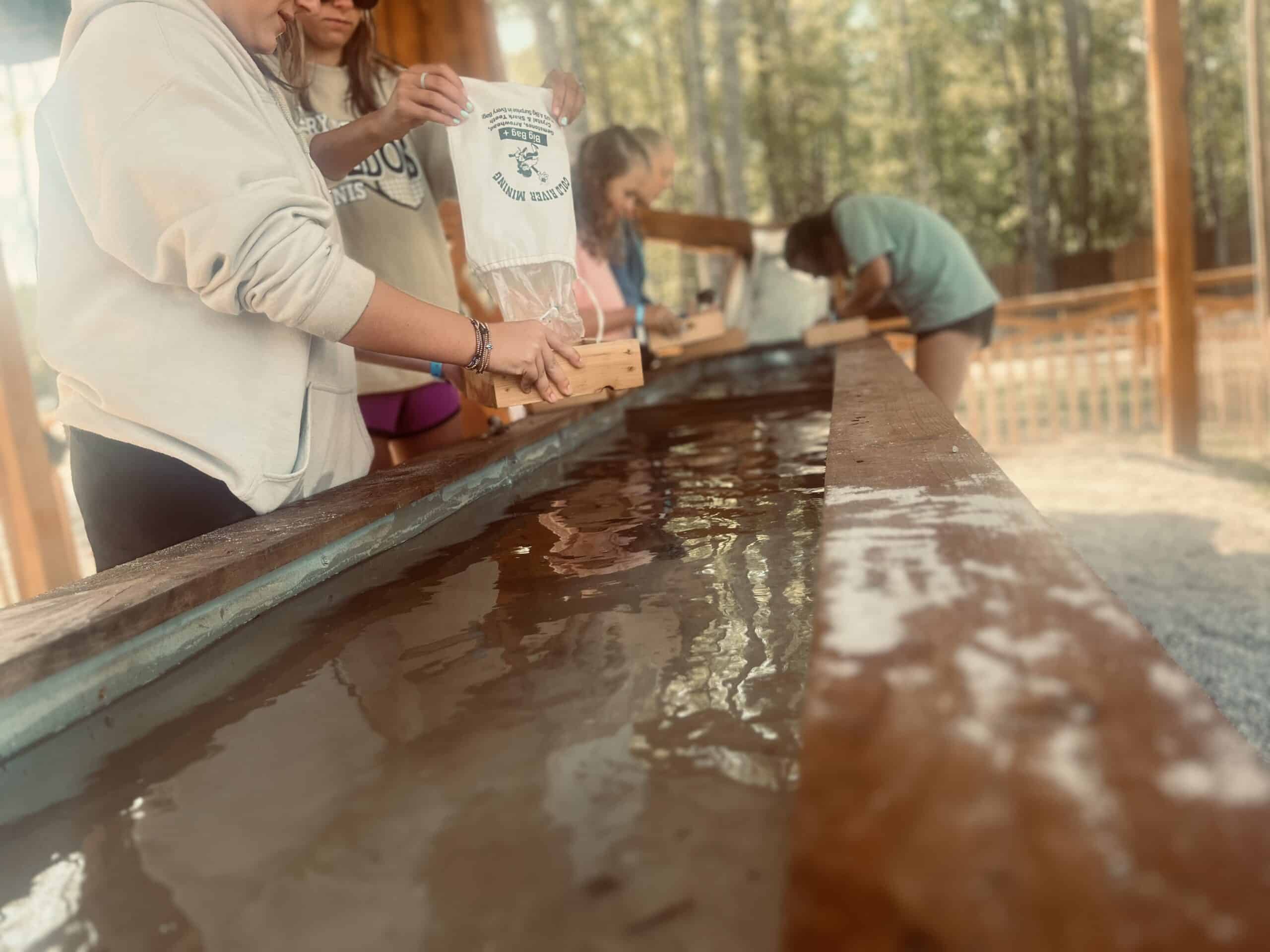 Guests enjoying gem mining at Sanwar RV Park & Resort