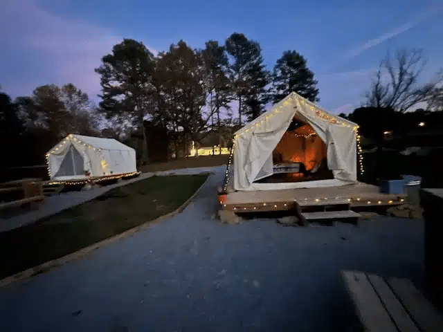 Furnished glamping tent beside the pond at Scenic City RV Campground