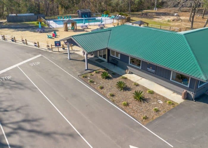 Aerial view of the office, swimming pool, and campground at Spacious Skies Savannah Oaks