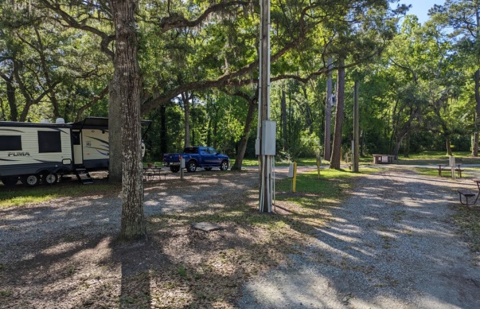RV site beneath oak trees at Spacious Skies Savannah Oaks