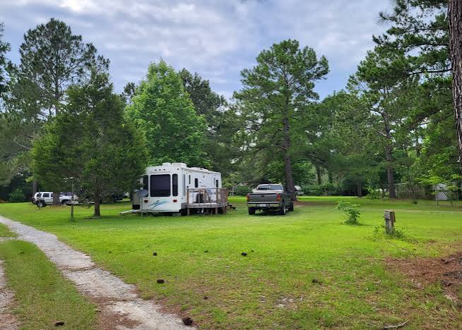 Grassy RV camping area at The Trolley Stop RV Park