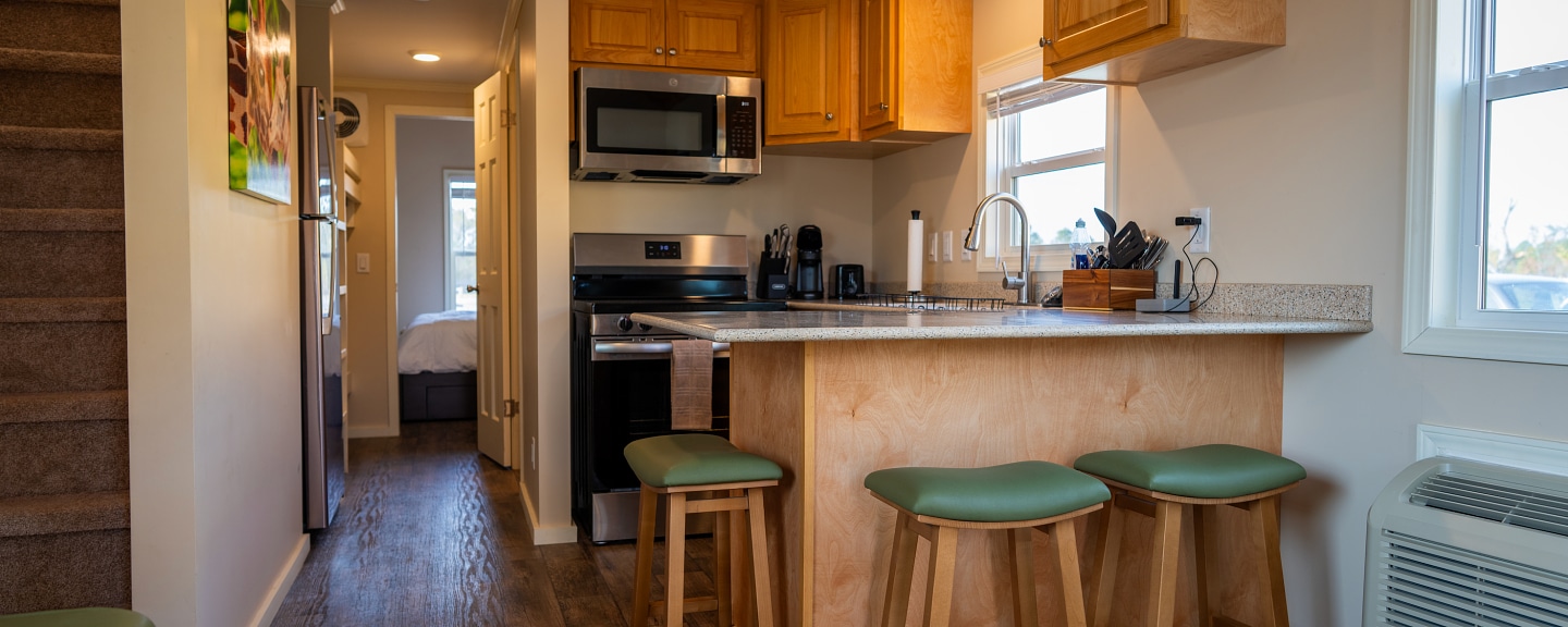 Kitchen inside a premium cottage at Wild Adventures Safari Campground