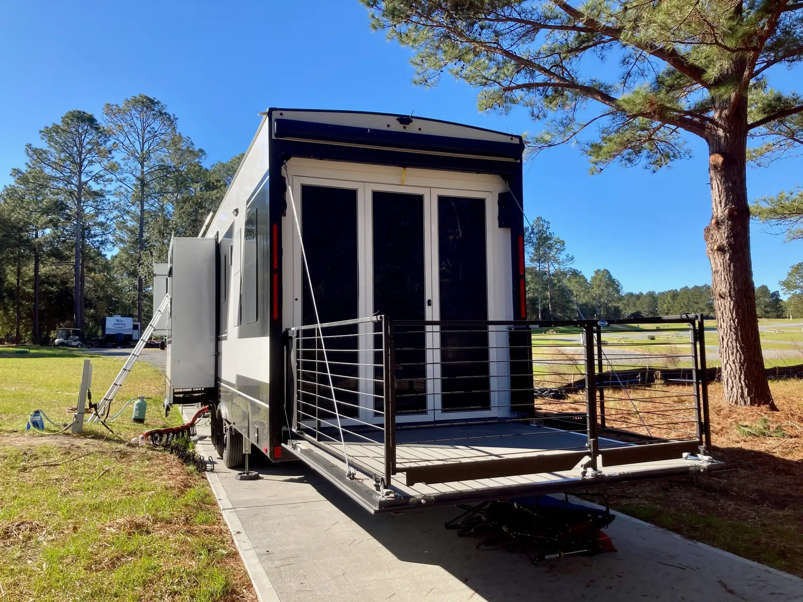 Guest RV with an outdoor deck at Wanee Lake Golf & RV Resort