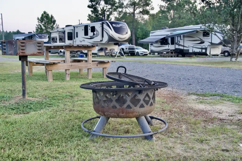 Grill and picnic table at an equipped Wanee Lake RV campsite