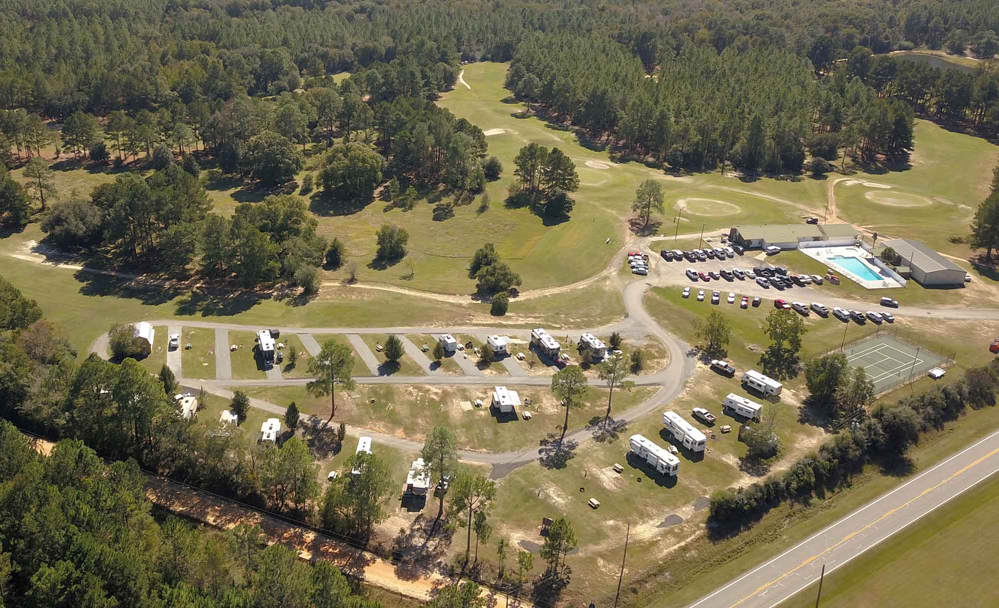 Aerial view of Wanee Lake Golf & RV Resort and the surrounding golf course