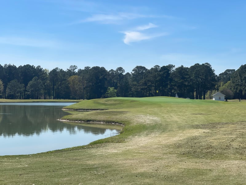 Lake and golf-course shoreline at Wanee Lake Golf & RV Resort
