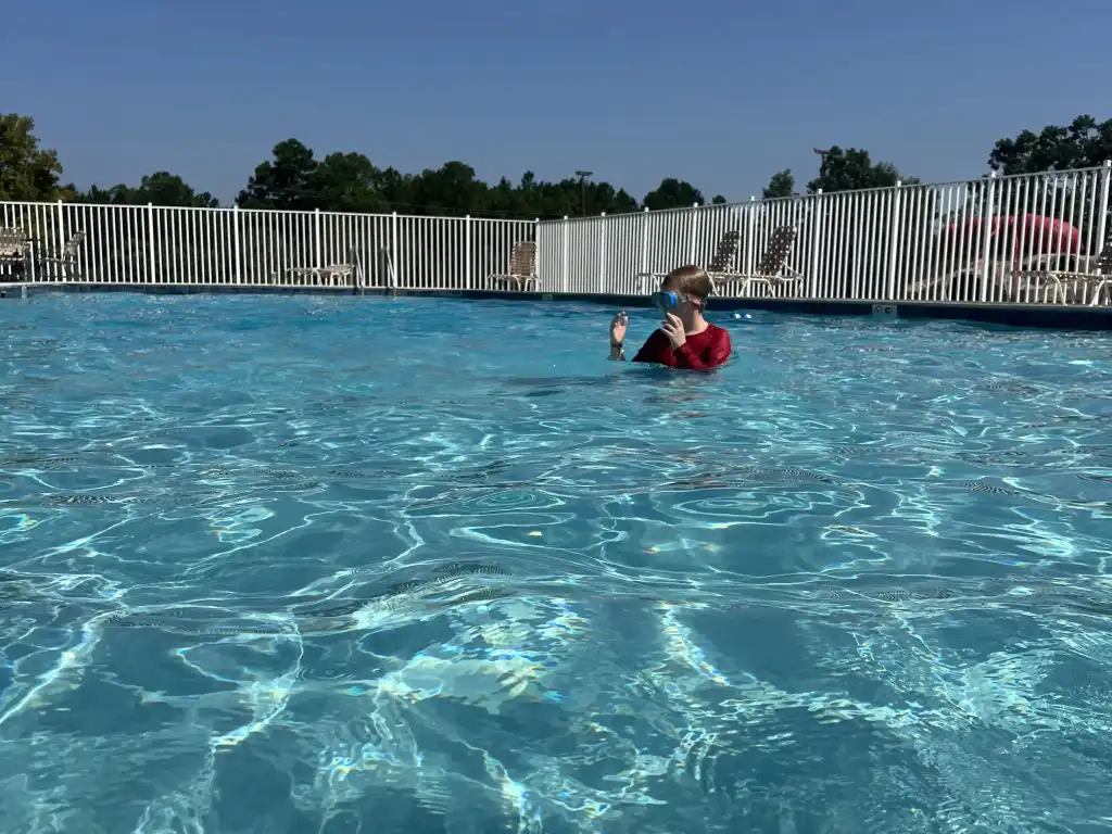 Guest enjoying the swimming pool at Wanee Lake Golf & RV Resort