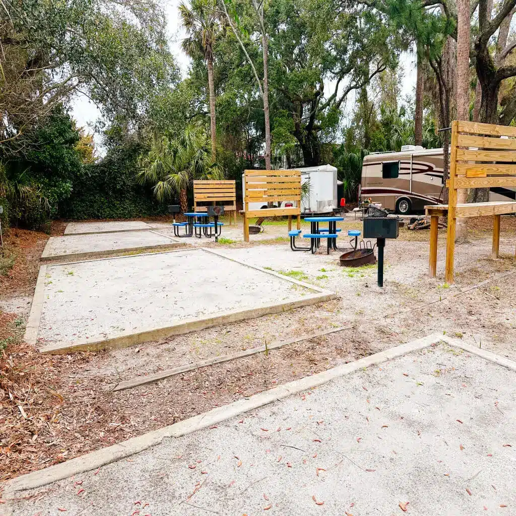 Camper and outdoor living area at River's End Campground & RV Park