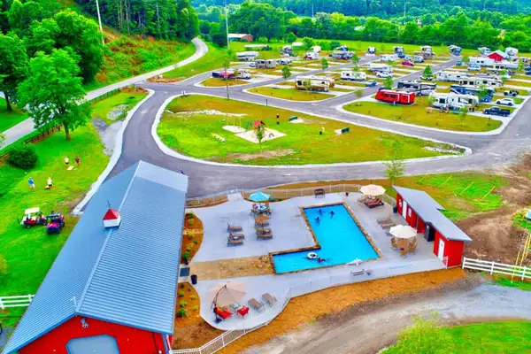 Aerial view of Willow Valley RV Resort, its pool, and camping areas
