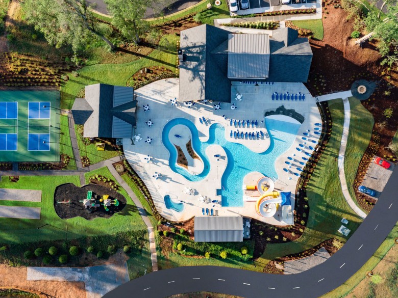 Aerial view of the pool and recreation area at Winding Waters Riverfront RV Resort