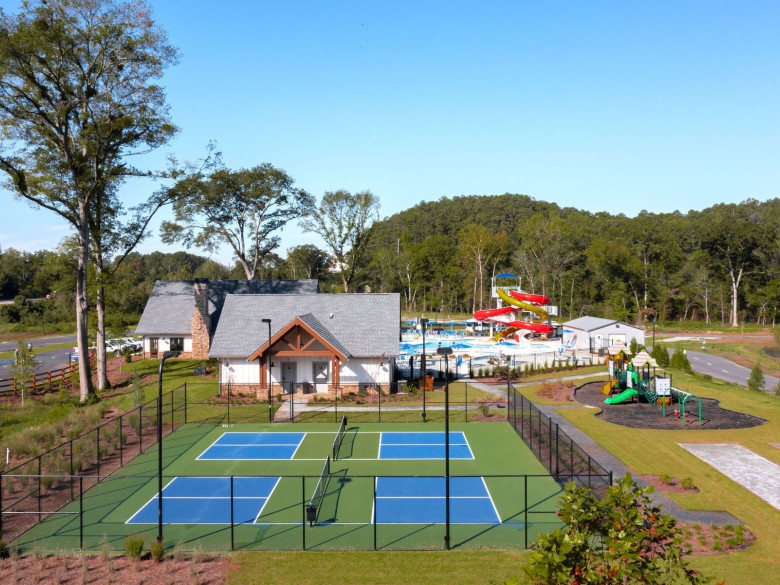 Pickleball courts and playground at Winding Waters Riverfront RV Resort