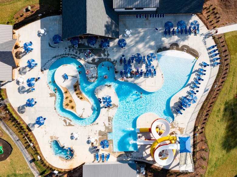 Swimming pool and lazy river at Winding Waters Riverfront RV Resort